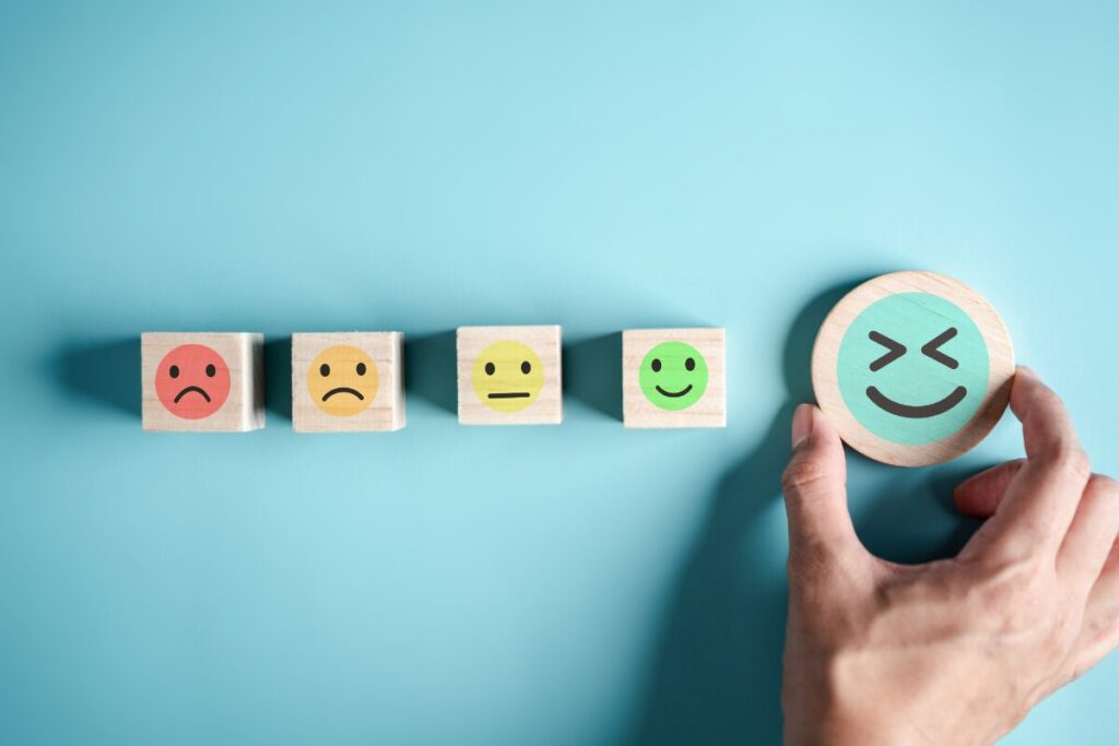 Blocks with different faces on them ranging from sad to very happy. 