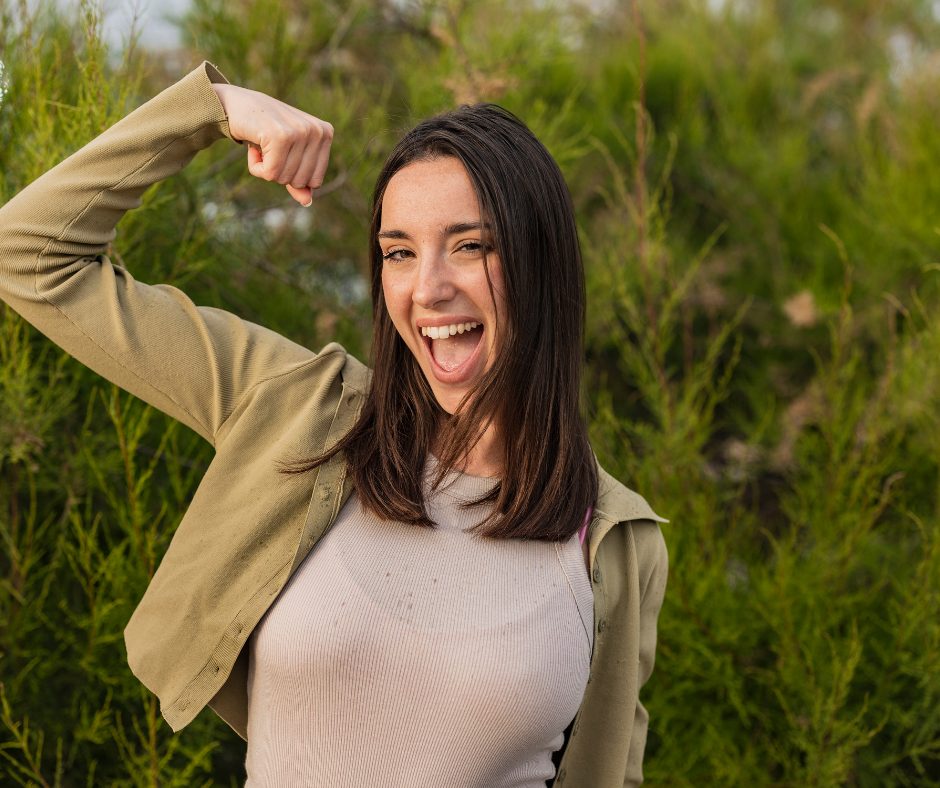 Woman in midlife feeling strong and energized after improving hormone balance and metabolism, representing successful weight loss after 40.