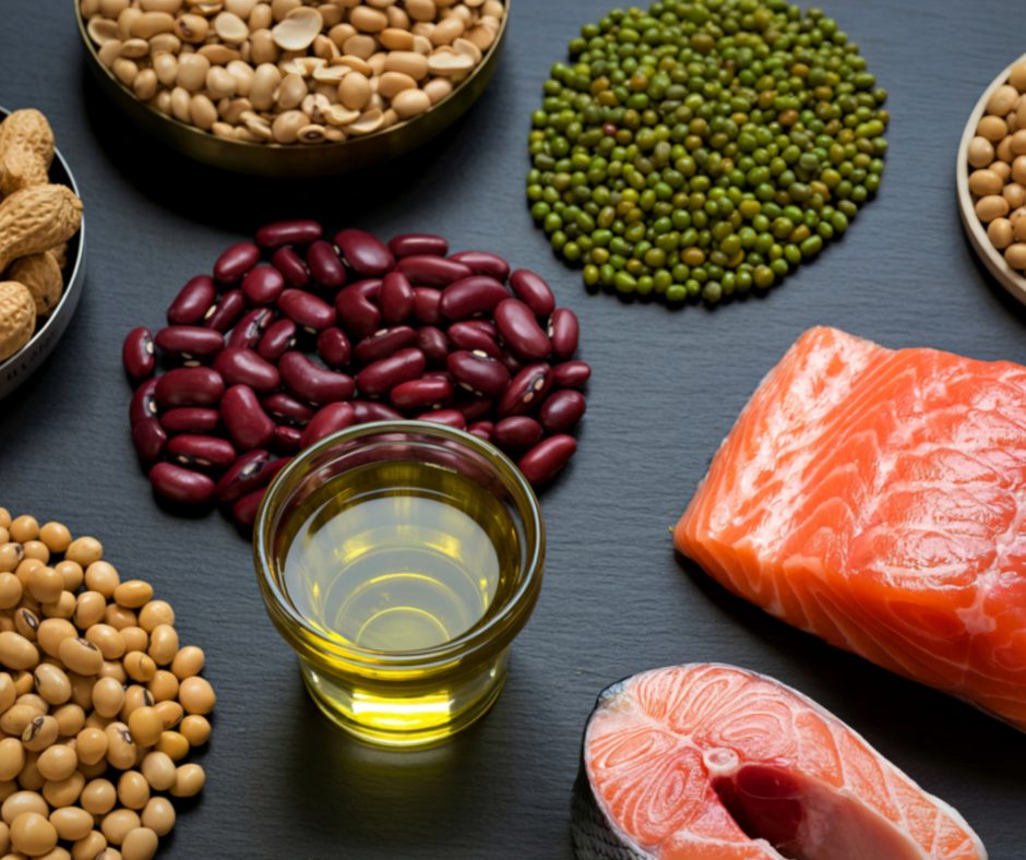 A display of healthy fats and protein including: salmon, olive oil, kidney beans, chickpeas, black eyed peas.